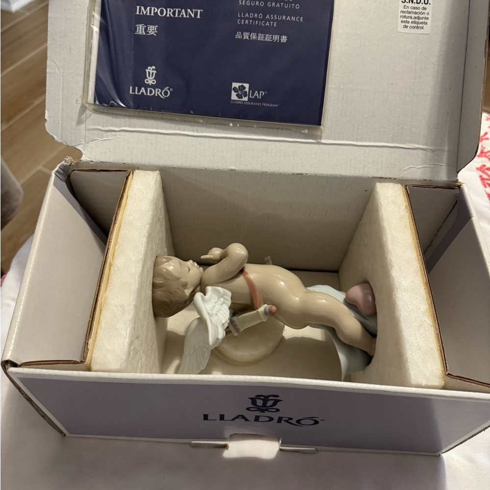 Lladro Cherub Figurine with White and Cream Accents